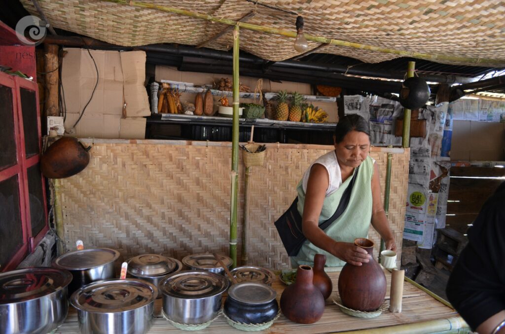 Interior of Mei Ram-ew Cafe, with the proprietor
